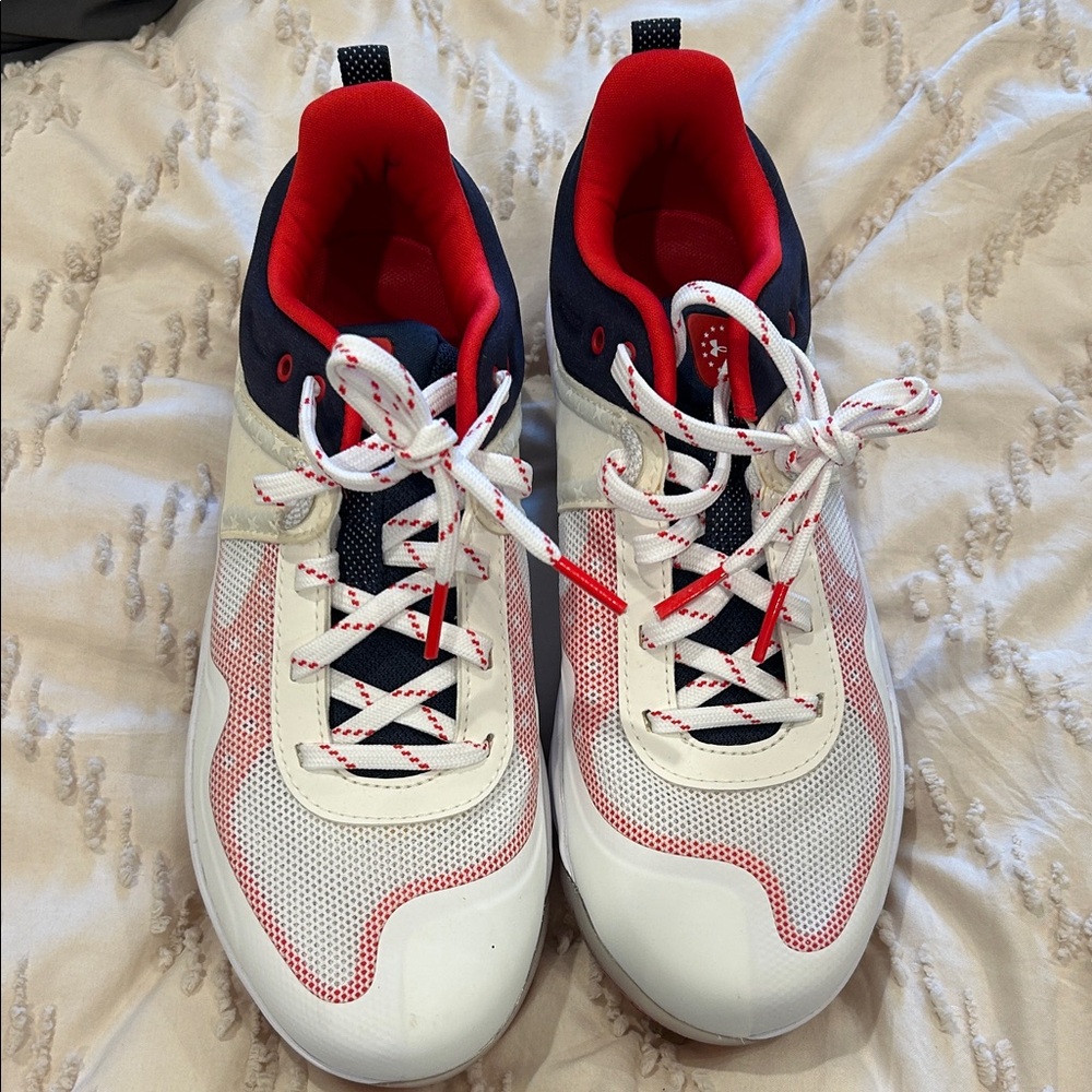 Stylish White and Red Metal Cleats